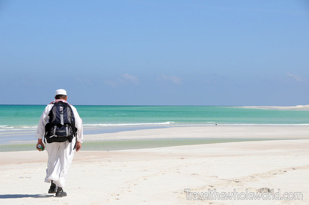Local man swimming at a beach in Socotra