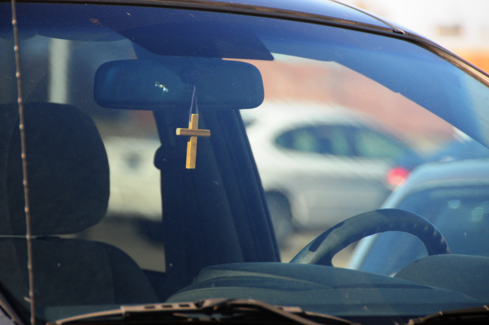 Christian cross hanging from a rearview mirror in Alabama