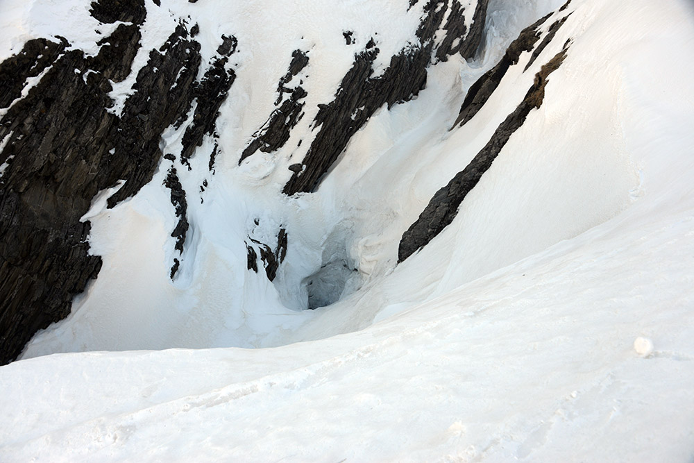 Steep snowy terrain and deep hole on the approach to Grossglockner