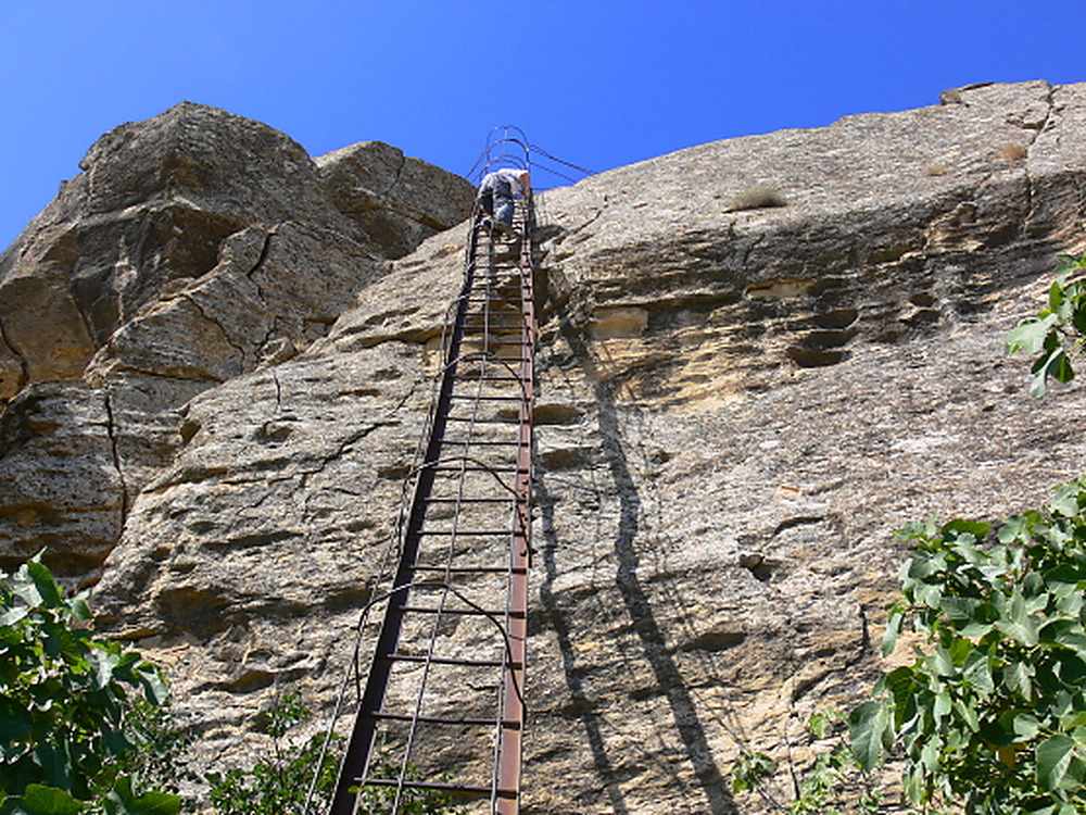 Steep ladder along the trail through the rocky terrain of Gobustan