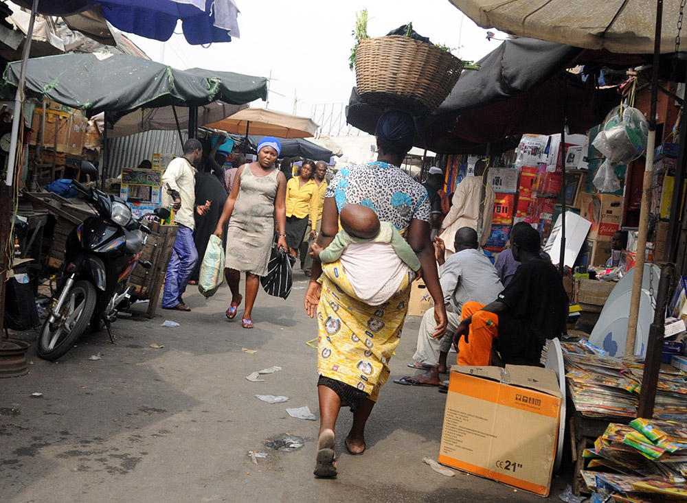 Busy market scene with shoppers in Cotonou, Benin