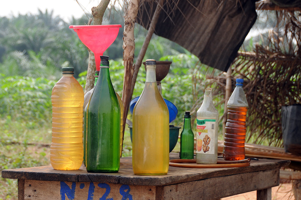 Roadside gasoline being sold in glass bottles near Porto-Novo, Benin