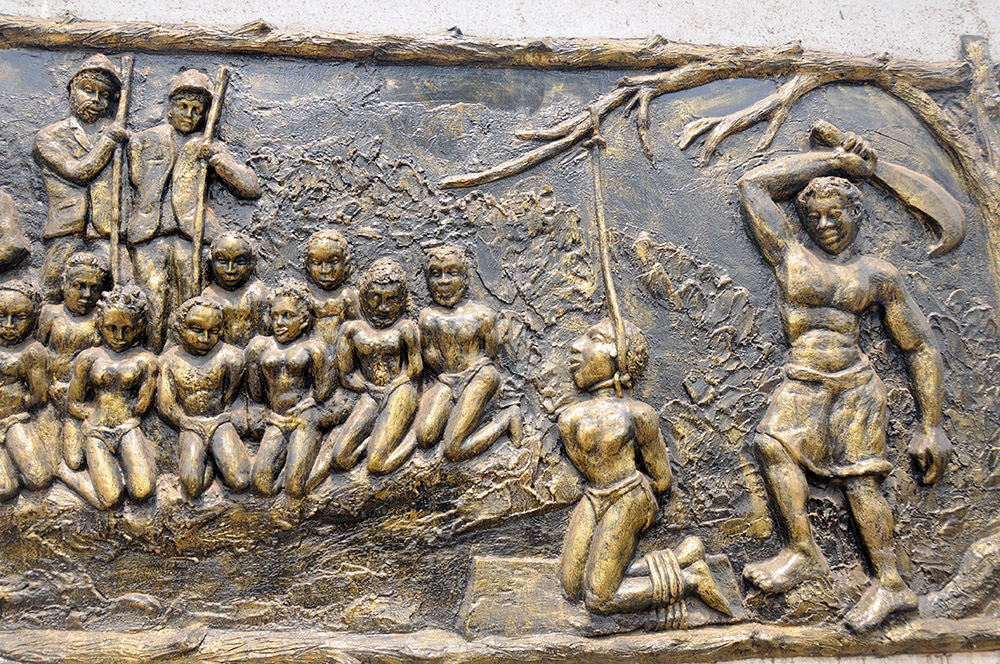 Historical mural depicting slavery in a museum in Porto-Novo, Benin