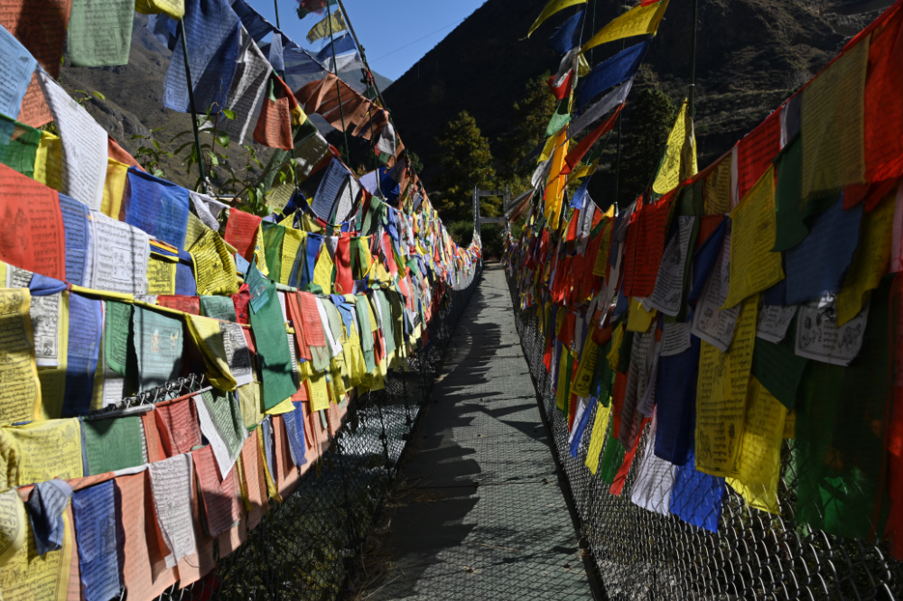 Prayer flags covering a bridge in the Punakha region of Bhutan