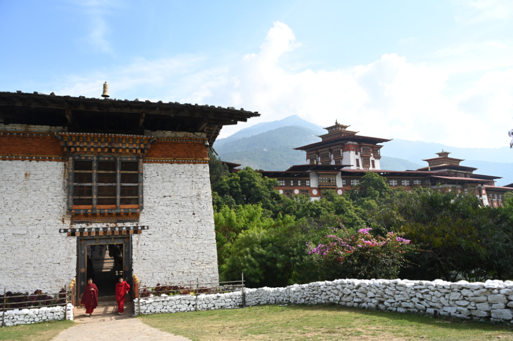 Traditional wooden bridge leading to Punakha Dzong in Bhutan