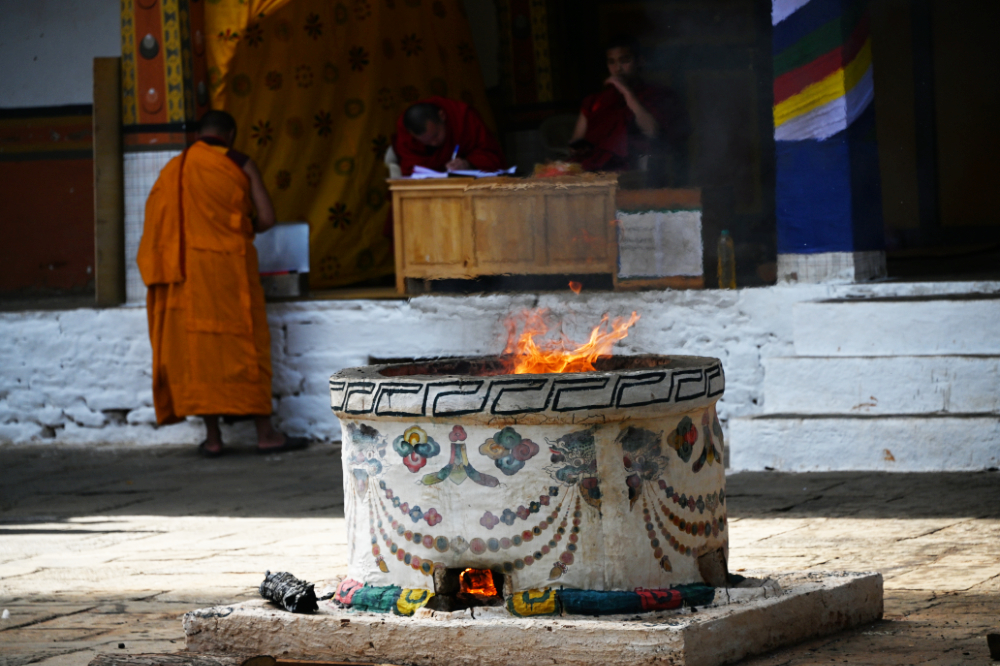 Religious butter lamps burning inside Punakha Dzong in Bhutan
