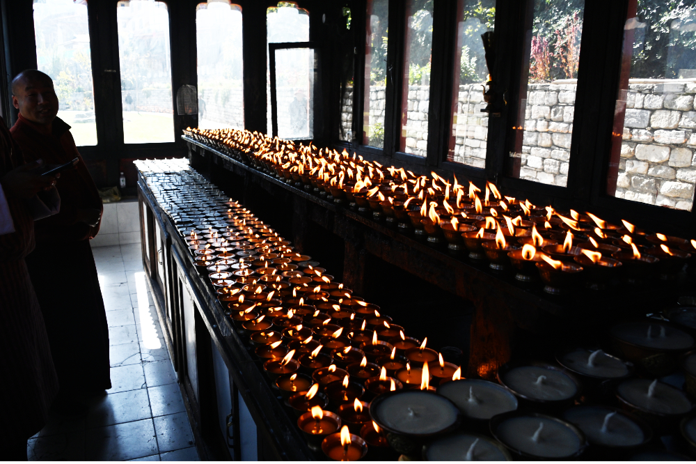 Butter lamps burning at the Memorial Chorten in Thimphu, Bhutan