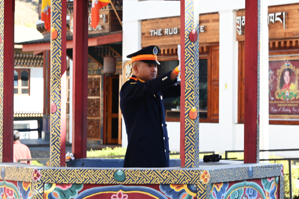 Traffic police officer directing vehicles at a traffic circle in Thimphu, Bhutan