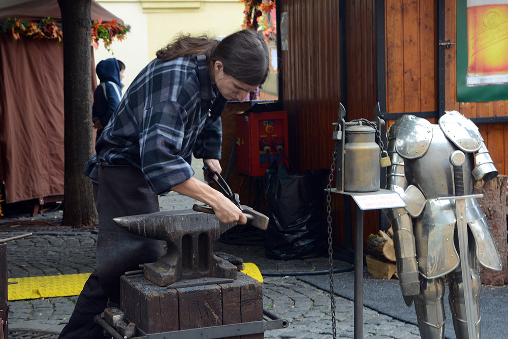 Blacksmith working at a Prague market