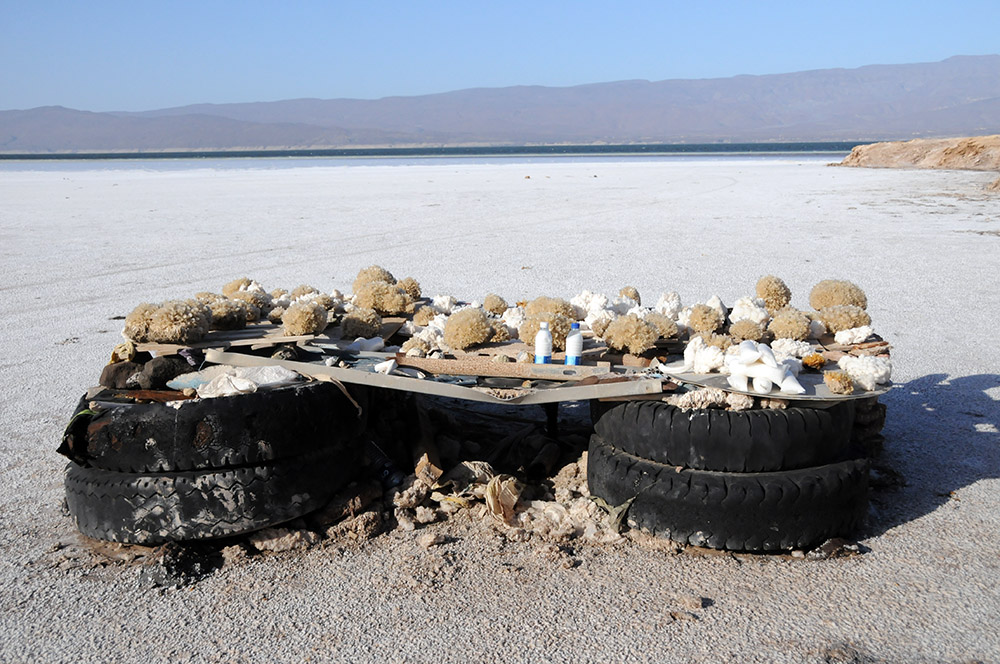 Vendor selling salt souvenirs beside Lake Assal in Djibouti