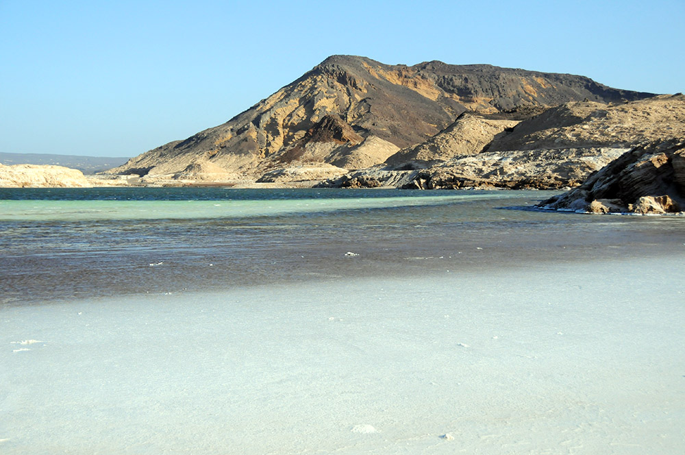 Lake Assal with colorful mountains in the background in Djibouti