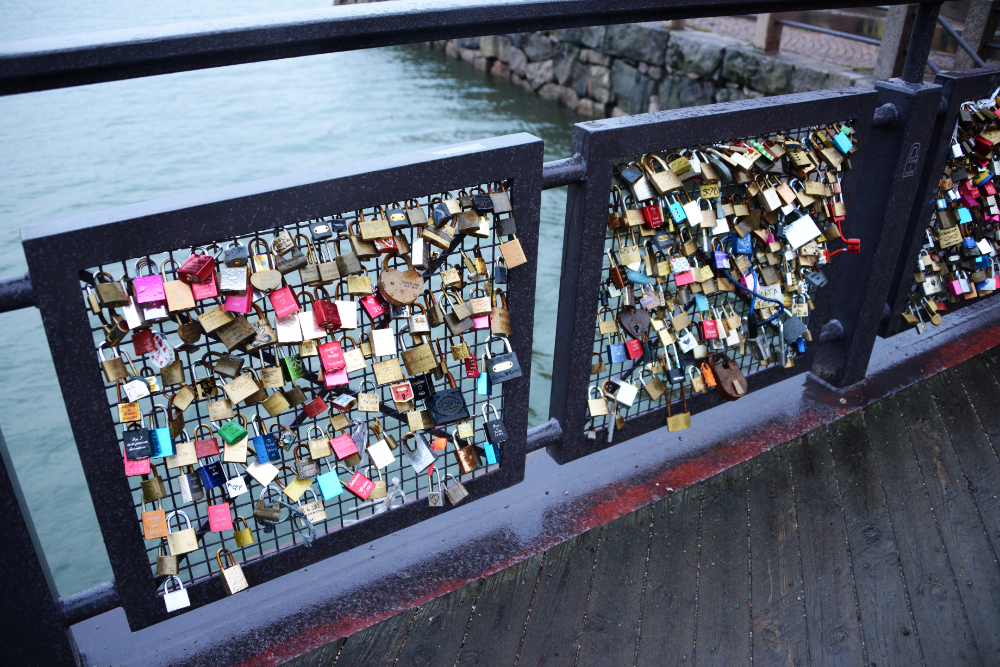 Love locks attached to a bridge in Helsinki, Finland