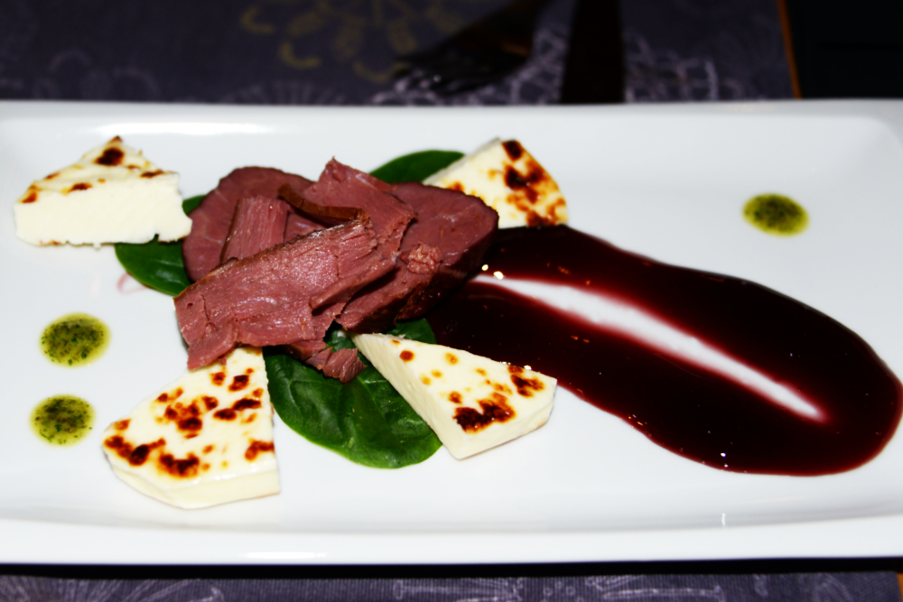 Elk and Finnish squeaky cheese appetizer at a restaurant in Helsinki