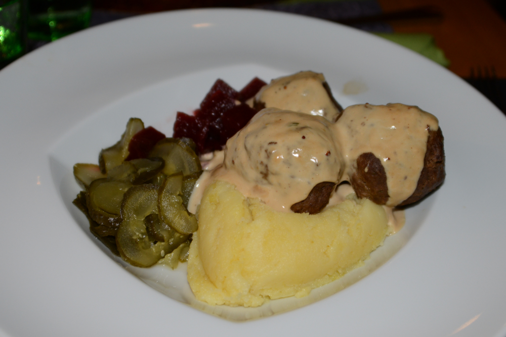 Meatballs with mashed potatoes and beets at a restaurant in Helsinki