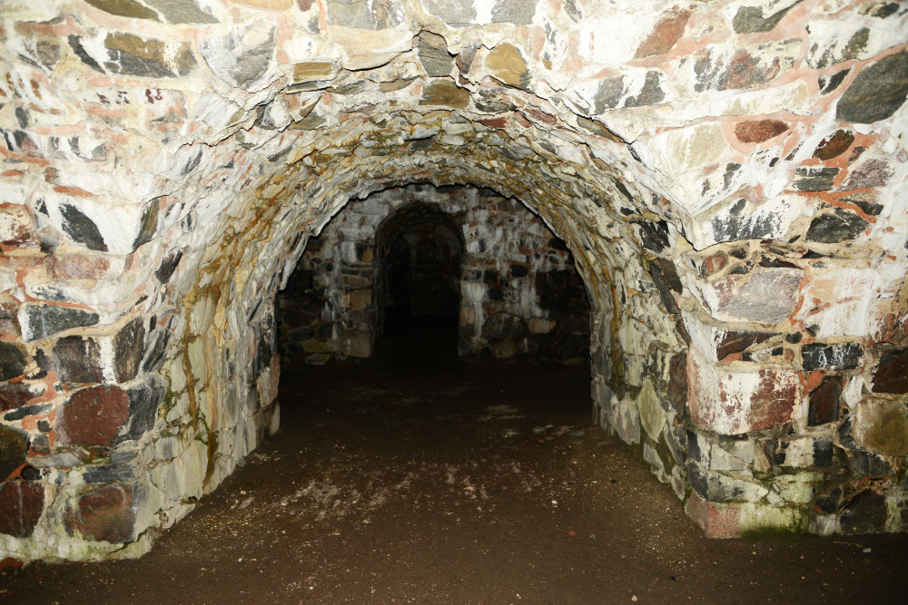 Dark stone tunnel inside Suomenlinna Fortress in Helsinki