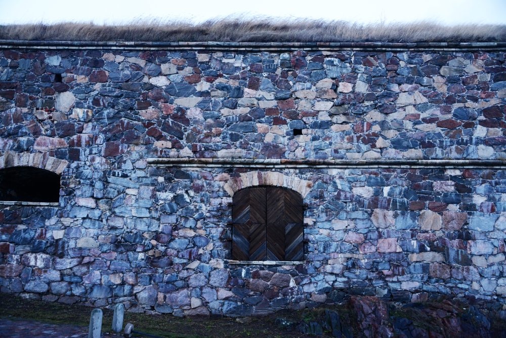 Stone defensive walls along the coast at Suomenlinna Fortress in Helsinki