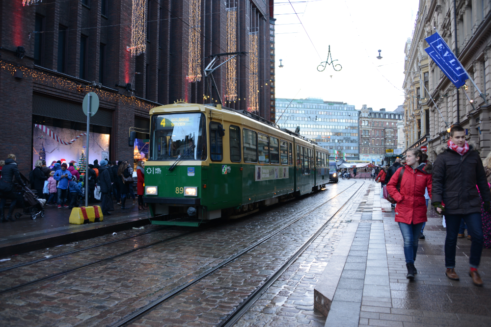 Trams and historic buildings along a street in central Helsinki