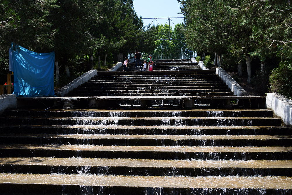 Water-covered steps at Meerim Park in Osh