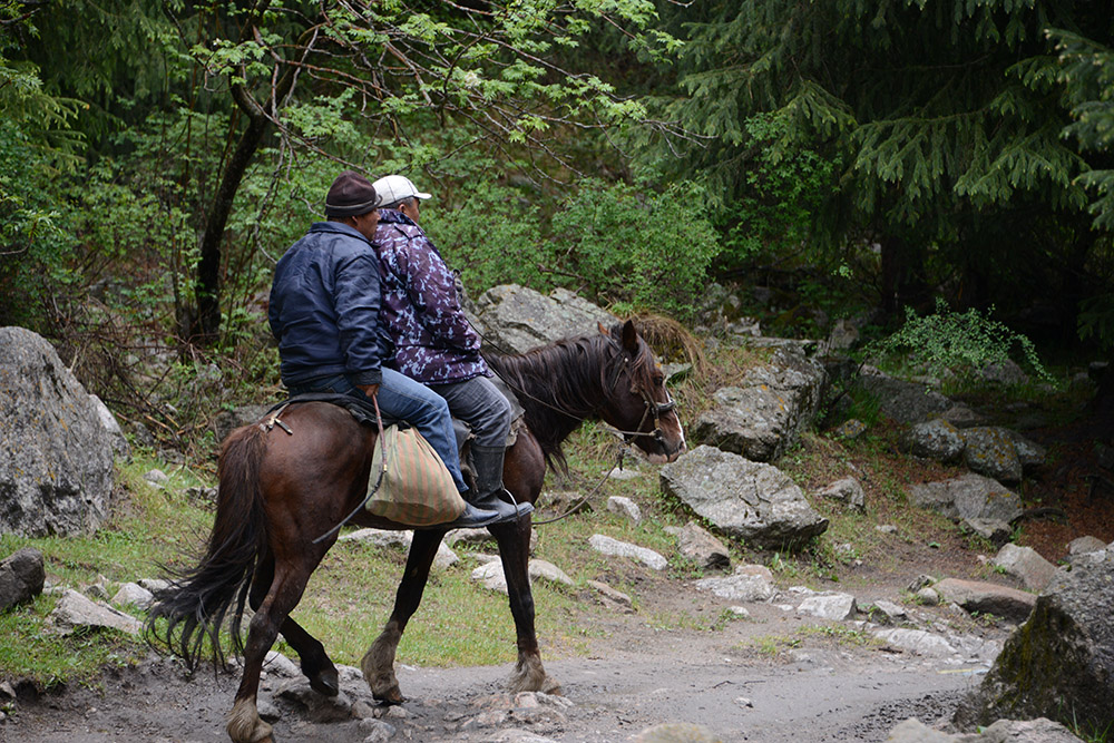 Horse riders in the Tian Shan Mountains