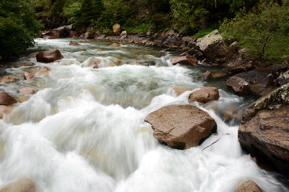 River flowing through the Tian Shan Mountains