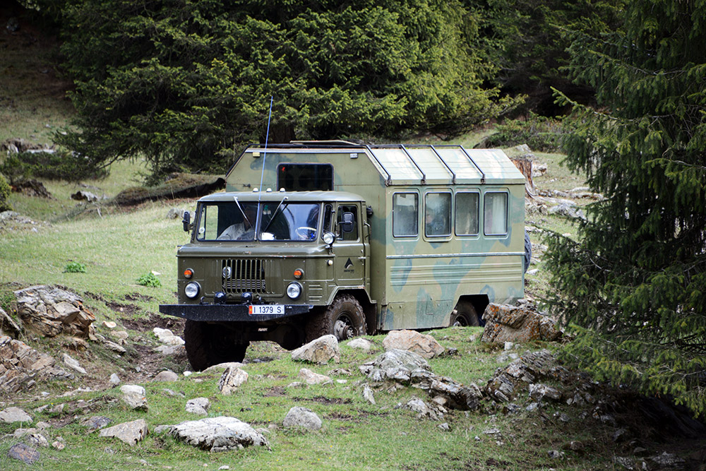Truck traveling through the Tian Shan Mountains