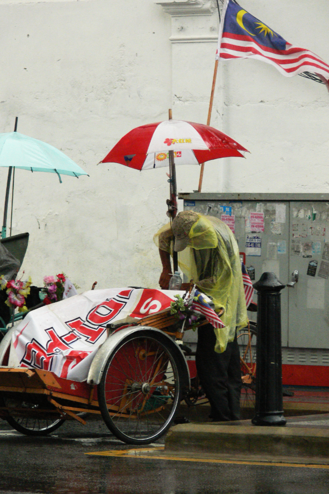 Man preparing for a rainstorm in Malaysia