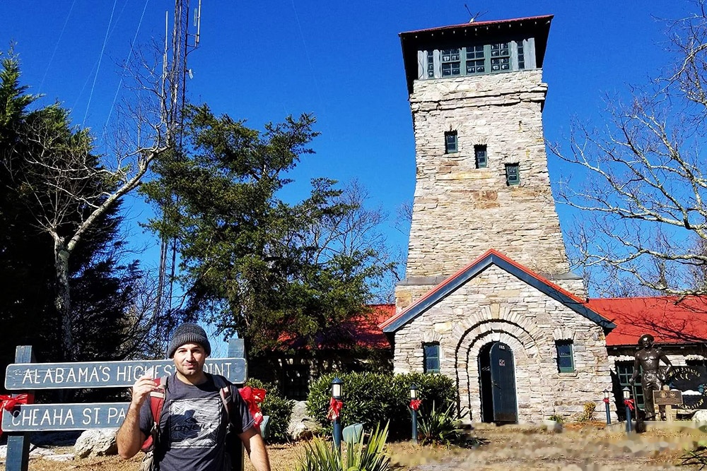 Standing at the summit of Cheaha Mountain in Alabama