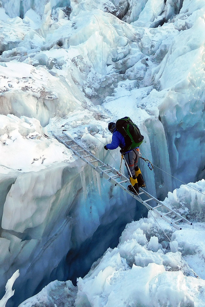 Crossing my first ladder in the Khumbu Icefall