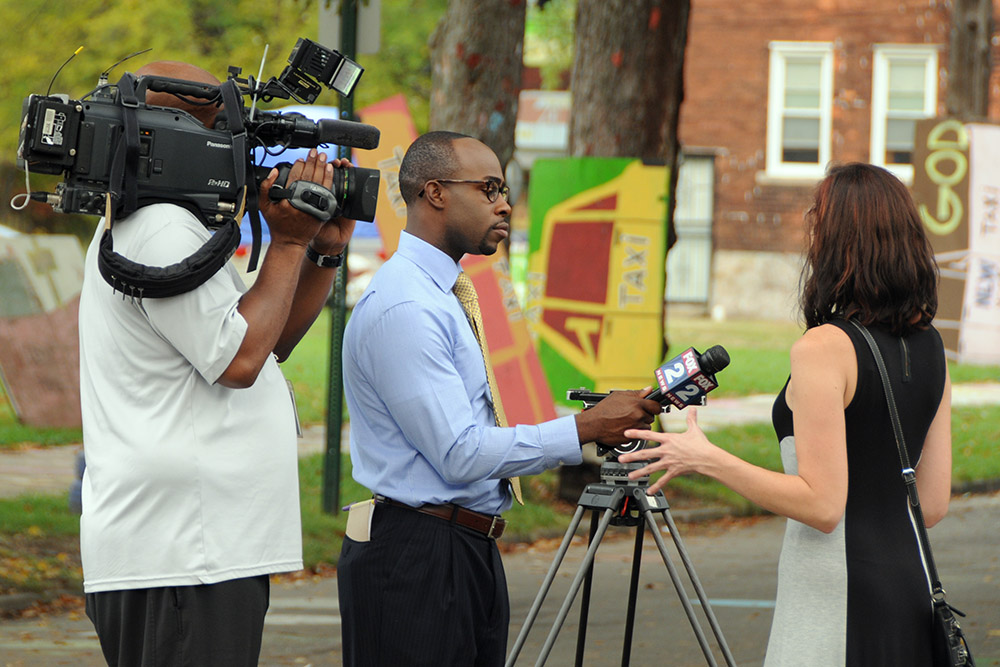 News crew reporting from the Heidelberg Project in Detroit