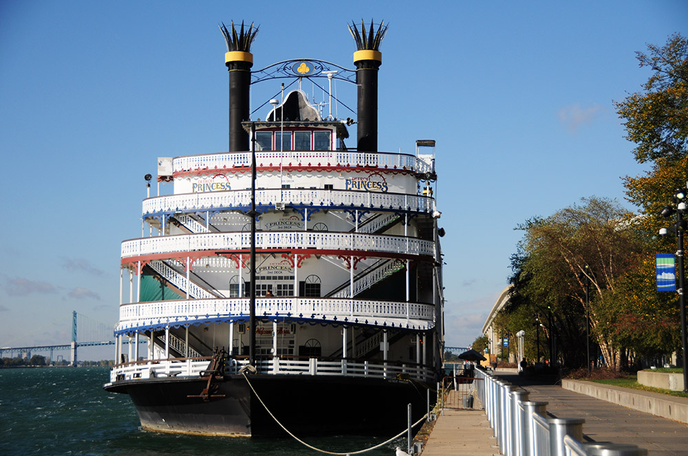 Boat on the Detroit River beside the Detroit RiverWalk