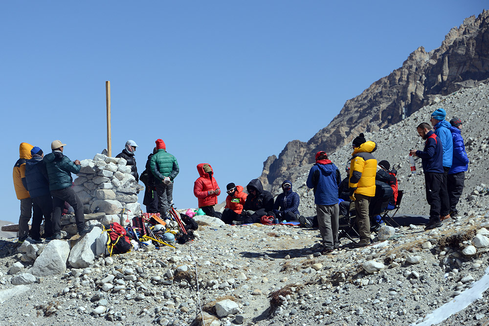 Expedition team preparing for a puja ceremony at Everest Base Camp