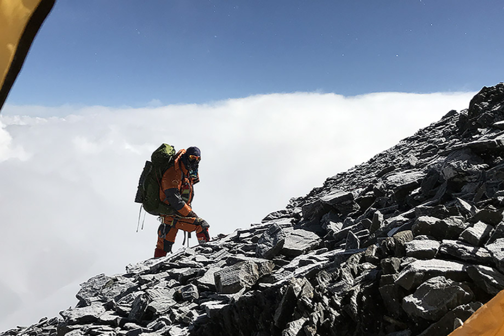 Climber passing Camp II on Mount Everest's North Ridge