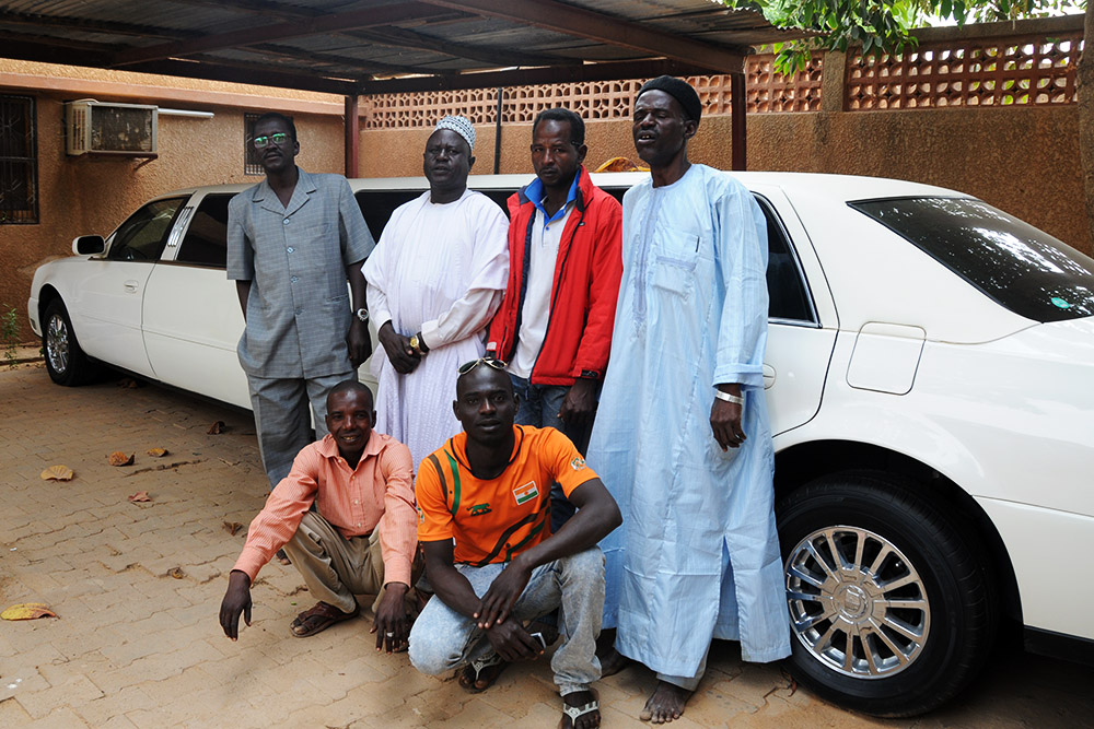 Sultan's Limousine People posing beside a limousine at the Sultan's Palace in Zinder Niger