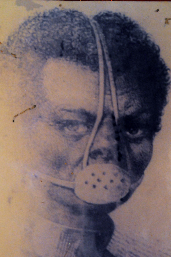Historical photograph displayed in Badagry documenting an enslaved African