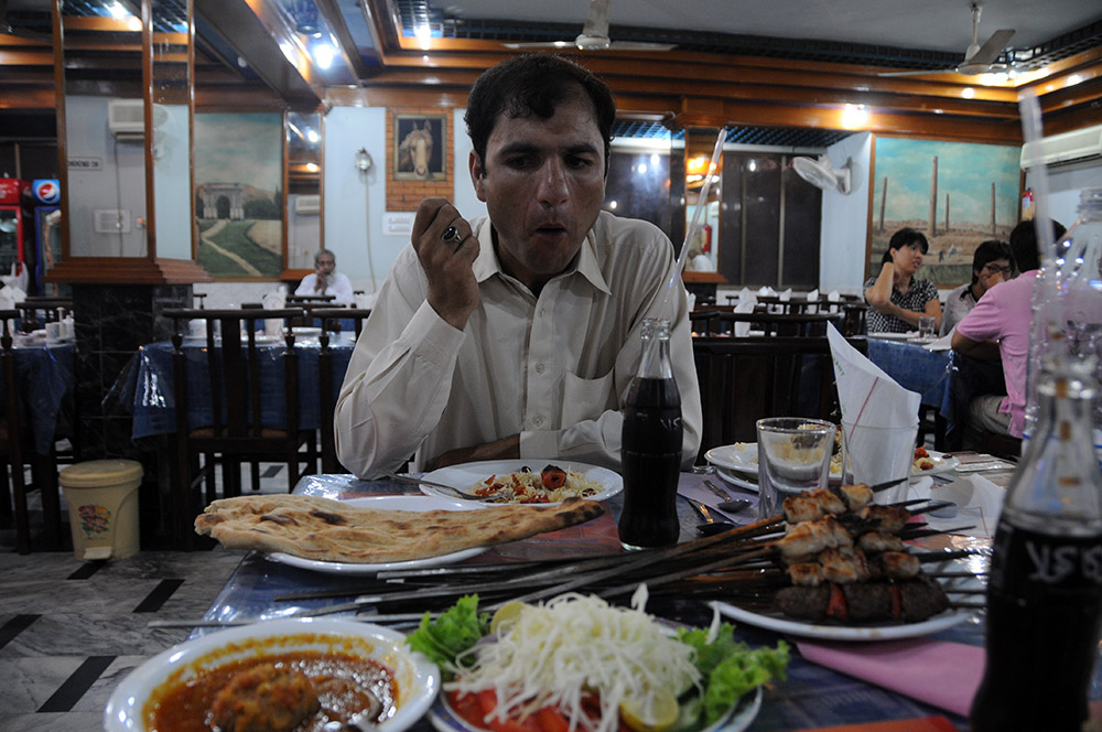 Afghan kebabs, salad and naan served at a restaurant in Islamabad, Pakistan
