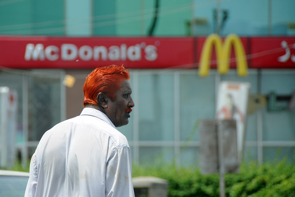 Man with brightly dyed hair in Karachi, Pakistan