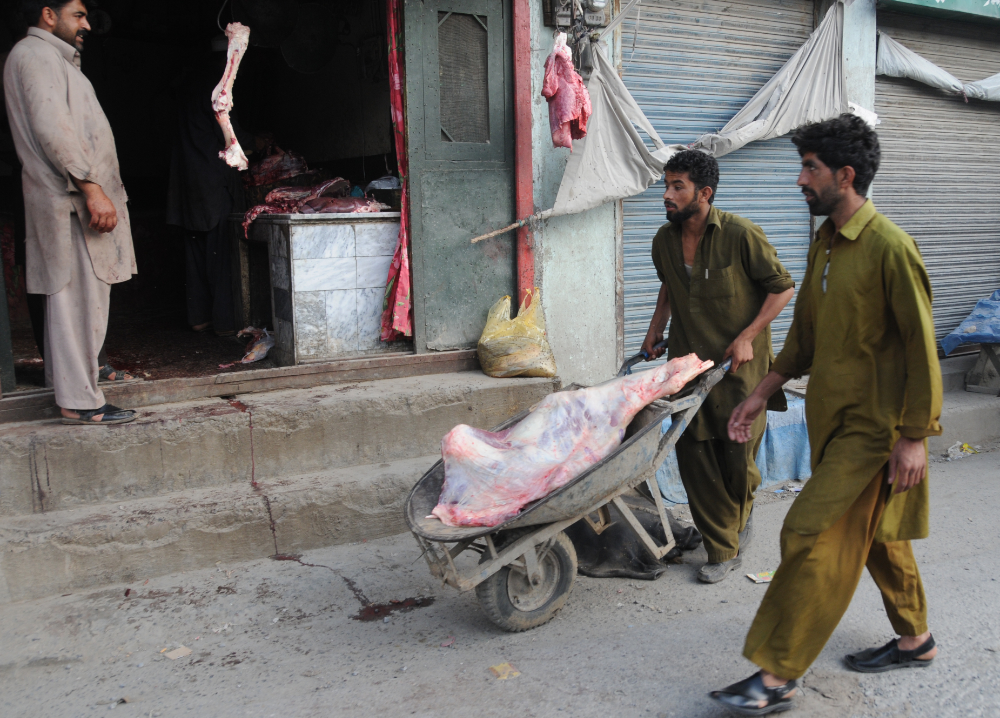 Meat being transported by wheelbarrow in Lahore Pakistan