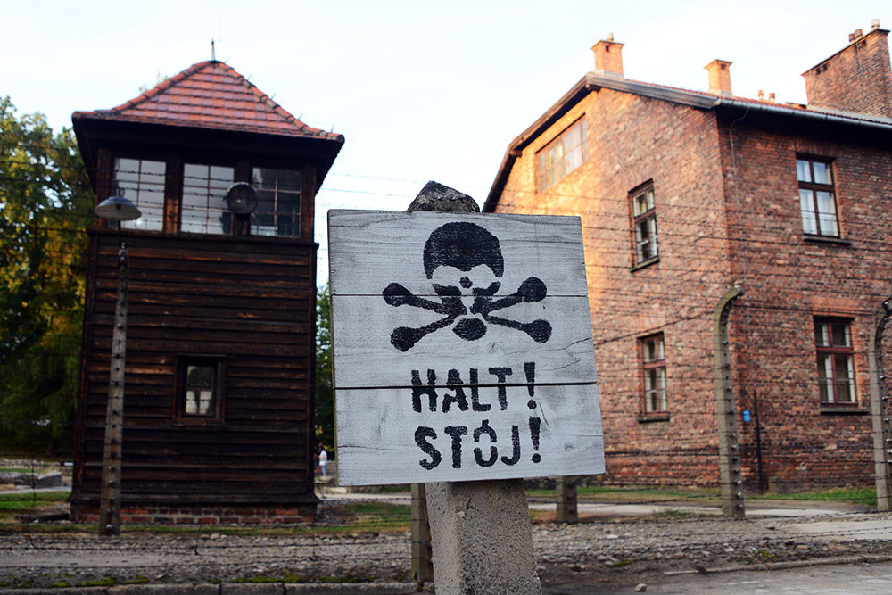 Warning sign and fence at Auschwitz I
