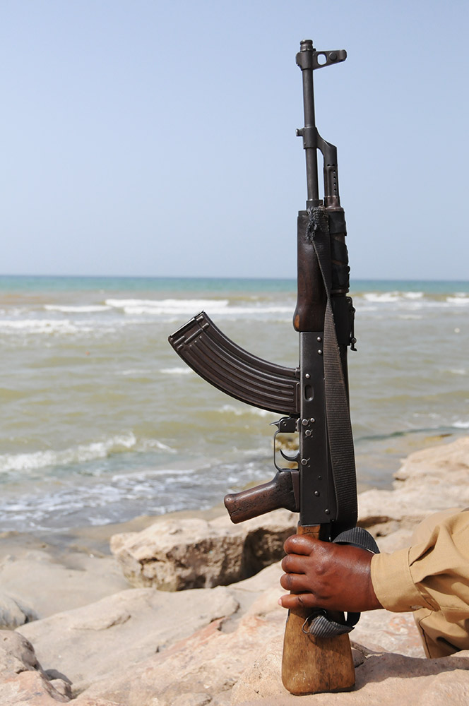 Armed guard accompanying me along the beach near Berbera, Somaliland