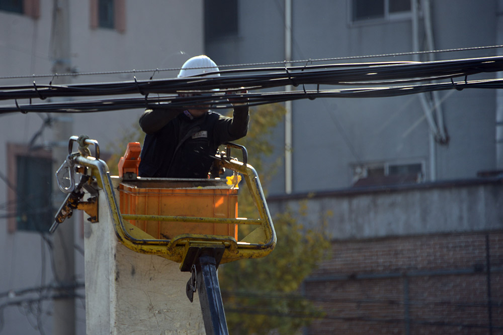 Worker cleaning utility lines in Gyeongju