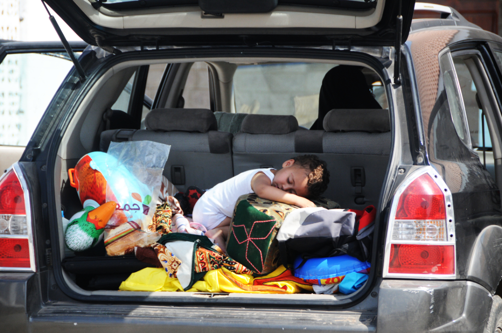 Family preparing for a road trip in Yemen