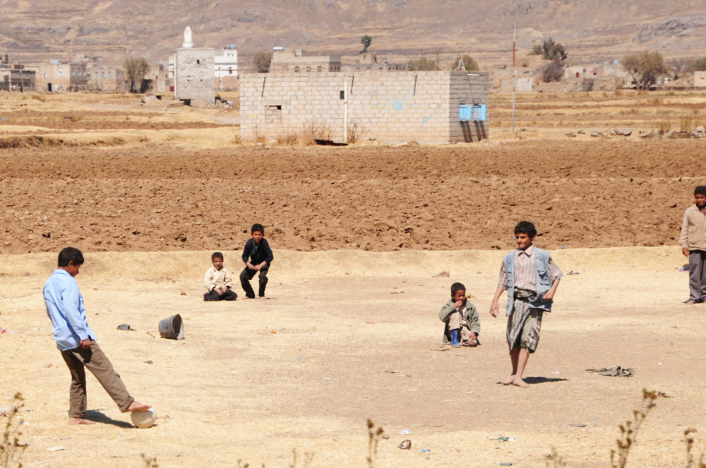 Boys playing soccer in Yemen