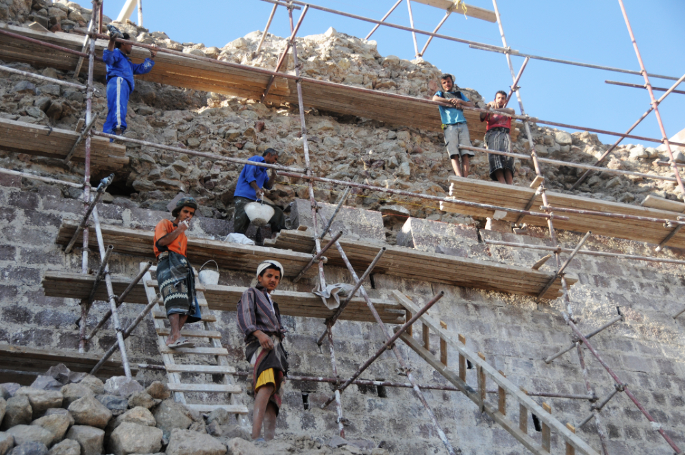Workers restoring Al-Qahira Castle in Taiz Yemen