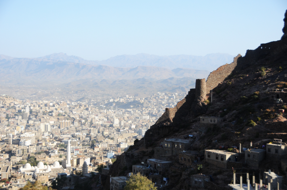 Historic city wall descending through the mountains of Taiz Yemen