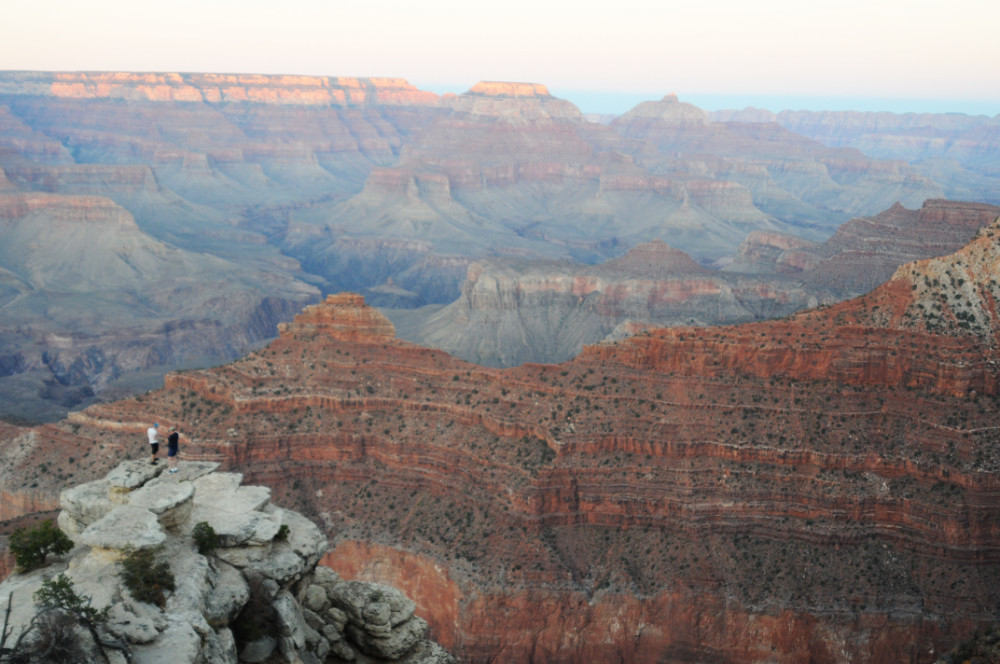 Visitor looking across the Grand Canyon from a viewpoint in Arizona