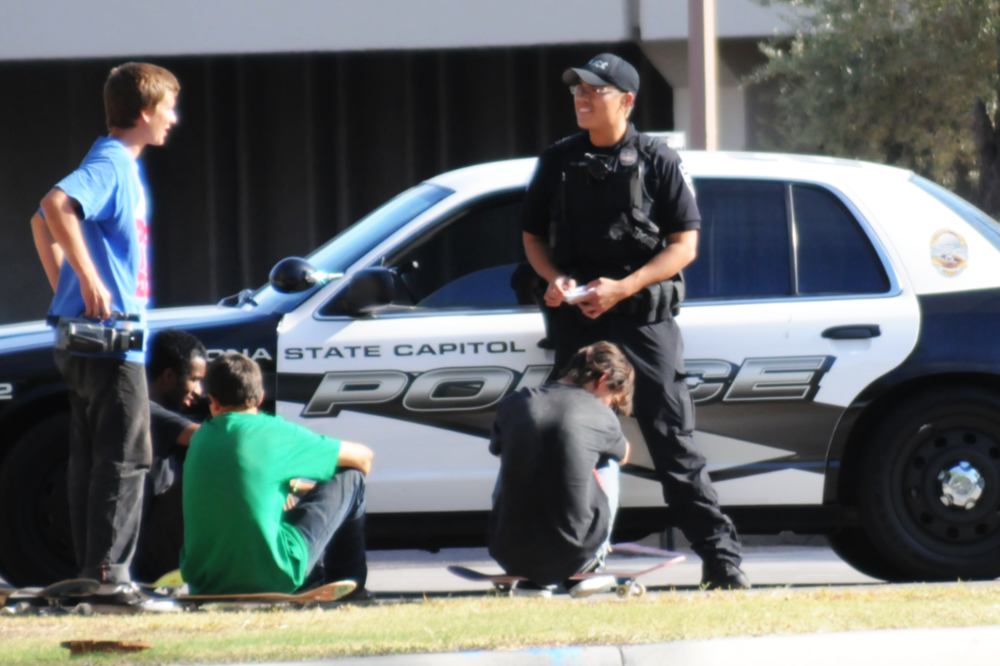 Police speaking with skateboarders in Tempe, Arizona