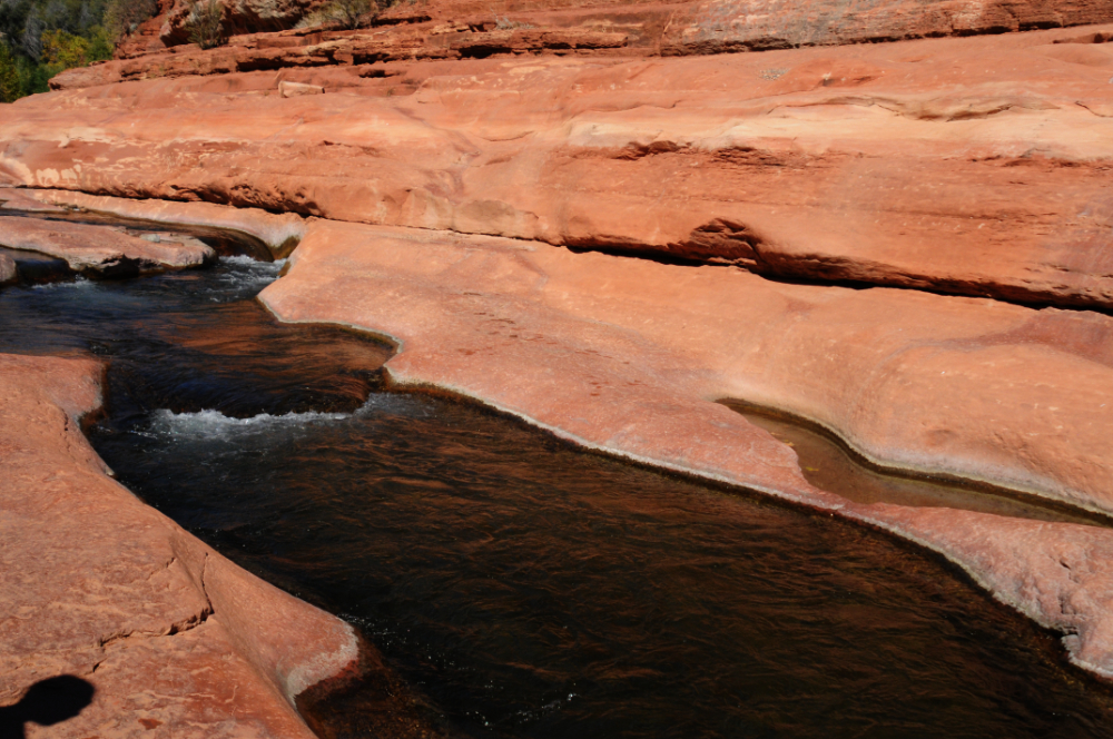 Natural sandstone water slide at Slide Rock near Sedona, Arizona
