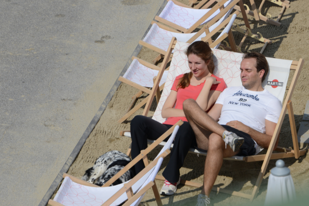Couple relaxing beside the water in Vienna