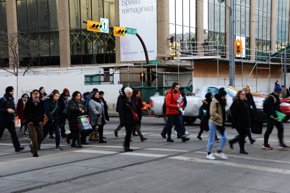 Pedestrians walking through downtown Calgary