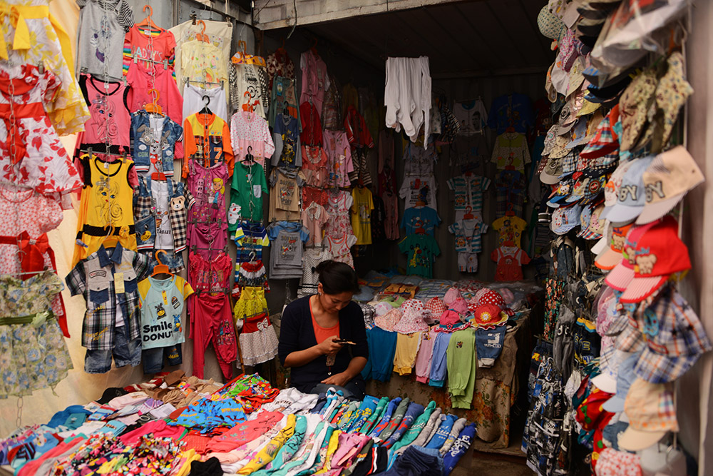 Shops at Osh Bazaar Small shops and merchandise inside the traditional Osh Bazaar